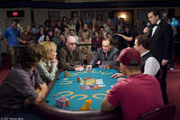 The Tournament Director (Matt Savage) watches over the action at the final table of the WSOP, occupied by Huck Cheever (Eric Bana), Michelle Carson (Jean Smart), Ralph Kaczynski (John Hennigan), L.C. Cheever (Robert Duvall) and Jason Keyes (Evan Jones) in "Lucky You."