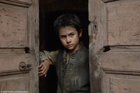 The 5-year-old Jean-Baptiste Grenouille (Alvaro Roque) is orphaned as a newborn in the streets of Paris in "Perfume: The Story of a Murderer."