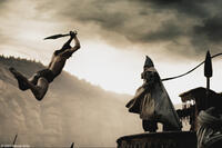 Stelios (Michael Fassbender) leaps over several guards to counter the attack of the Persian emissary (Tyrone Benskin) in "300."