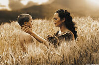 Gorgo (Lena Headey) comforts her son, Pleistarchos (Giovani Antonio Cimmino), in "300." 