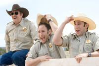 The officers enjoy their bull-slapping fun in "Wild Hogs."