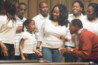 Jamia Simone Nash as Hope and Mykelti Williamson as Reverend James in "August Rush."