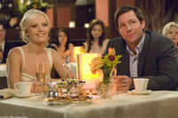 Newly engaged couple Tess (Malin Akerman) and George (Edward Burns) enjoy a party thrown on their behalf -- not realizing their relationship is about to be forever changed in "27 Dresses."