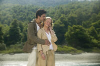 Sky Hansen (DOMINIC COOPER) holds tight to fiance Sophie Sheridan (AMANDA SEYFRIED) in "Mamma Mia!"