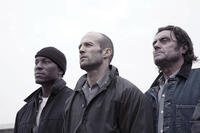 Machine Gun Joe (Tyrese Gibson), Jensen Ames (Jason Statham) and Coach (Ian McShane) in "Death Race."
