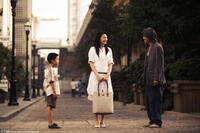 Xu Jiao as Dicky Chow, Kitty Zhang as Miss Yuen, Stephen Chow as Ti Chow in "CJ7."