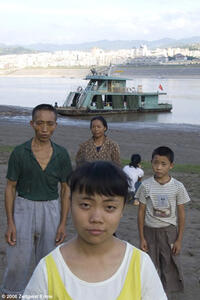 The Yu family on the banks of the Yangtze in UP THE YANGTZE, a film by Yung Chang, a Zeitgeist Films release. Photo: Yung Chang