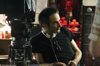 Director Olivier Assayas on the set of "Boarding Gate."