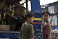 Ayush Mahesh Khedekar as youngest Jamal and Azharuddin Mohammed Ismail as youngest Salim in "Slumdog Millionaire."