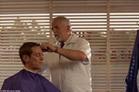 John Ratzenberger as Art in "The Village Barbershop."