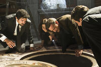 Pierfrancesco Favino as Inspector Olivetti, Ayelet Zurer as Vittoria Vetra, Tom Hanks as Robert Langdon and David Pasquesi as Claudio Vincenzi in "Angels & Demons."