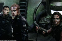 Cung Le as Manh, Ben Foster as Bower and Antje Traue as Nadia in "Pandorum."