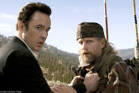 John Cusack as Jackson Curtis and Woody Harrelson as Charlie Frost in "2012."