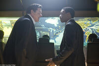 Oliver Platt as Carl Anheuser and Chiwetel Ejiofor as Adrian Helmsley in "2012."