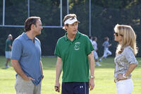 Tim McGraw as Sean Tuohy, Ray McKinnon as Coach Cotton and Sandra Bullock as Leigh Anne Tuohy in "The Blind Side."