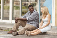 Quinton Aaron as Michael Oher and Sandra Bullock as Leigh Anne Tuohy in "The Blind Side."