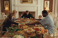 Lily Collins as Collins, Sandra Bullock as Leigh Anne Tuohy, Tim McGraw as Sean Tuohy, Jae Head as S.J. and Quinton Aaron as Michael Oher in "The Blind Side."