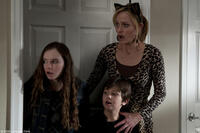 Madeline Carroll as Farren, Will Shadley as Ian and Amber Valletta as Gillian in "The Spy Next Door."