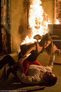 Zoe Saldana as Aisha and Jeffrey Dean Morgan as Clay in "The Losers."