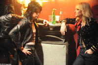 Kristen Stewart as Joan Jett and Dakota Fanning as Cherie Currie in "The Runaways."