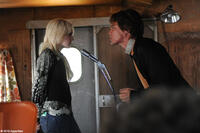 Dakota Fanning as Cherie Currie and Michael Shannon as Kim Fowley in "The Runaways."
