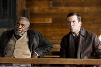 Bill Cobbs as Rev. Jackson and Lucas Black as Buddy in "Get Low."
