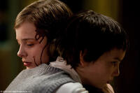 Chloe Grace Moretz as Abby and Kodi Smit-McPhee as Owen in "Let Me In."