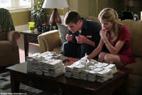 Chris Hemsworth as Sam and Victoria Profeta as Leslie in "Ca$h."
