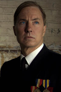 Lee Perkins as F. Ellis Coburn in ``The Red Machine.''