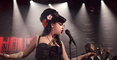'Back To Black' Is In Theaters Now: Watch An Exclusive Video With Star Marisa Abela