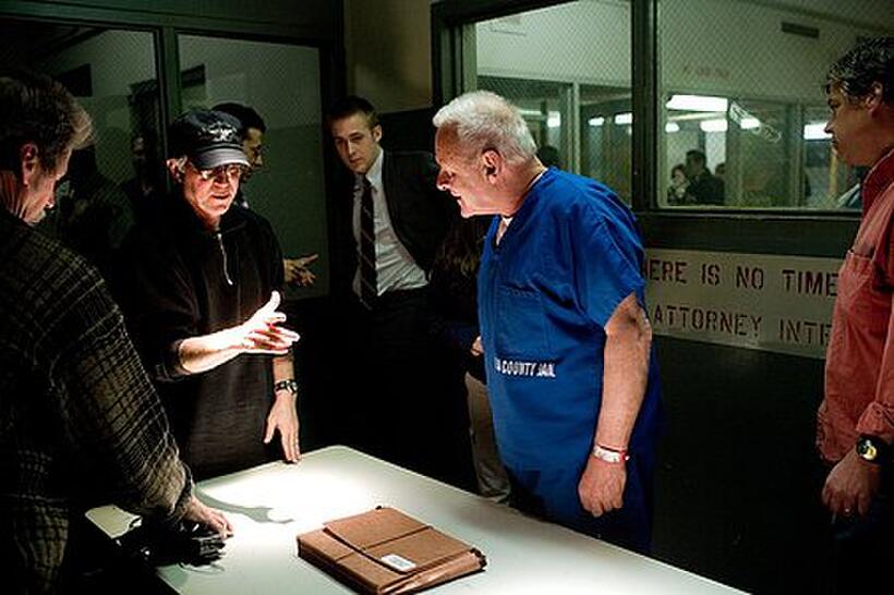 Director Gregory Hoblit, Ryan Gosling and Anthony Hopkins on the set of "Fracture."