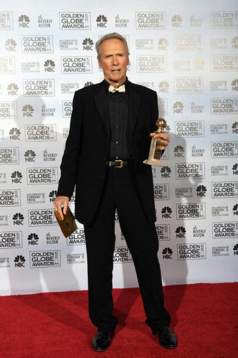 Clint Eastwood holds his award for Best Director of a Foreign Language Film at the 12th Annual Critics' Choice Awards 