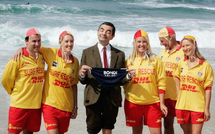 Actor Rowan Atkinson with Life Savers at Bondi Beach in Australia to promote "Mr. Bean's Holiday." 