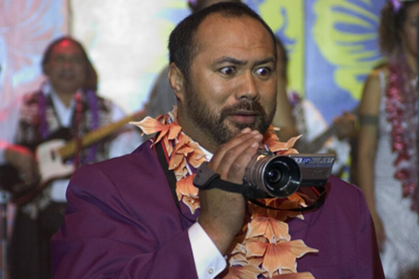 Bolo (Dave Fane) at a wedding reception in "Samoan Wedding."