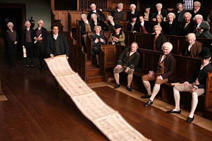 William Wilberforce (Ioan Gruffudd) displays a petition for abolition in "Amazing Grace."