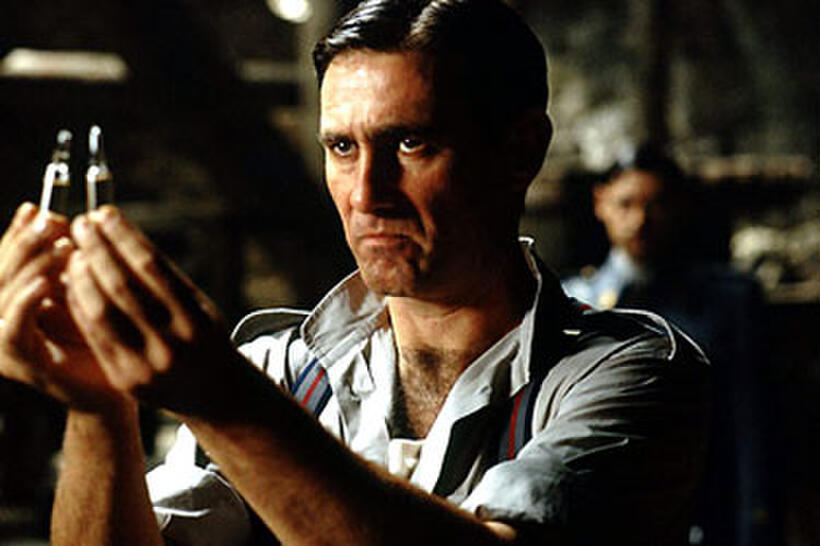 The captain (Sergi López) compares two bottles of antibiotics in "Pan's Labyrinth."