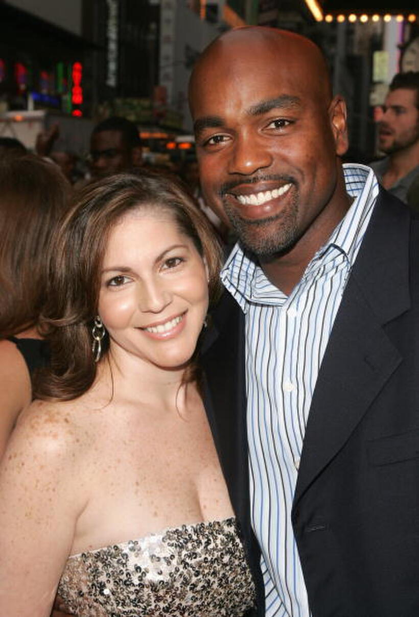 Baseball player Carlos Delgado and guest at the N.Y. premiere of "El Cantante."