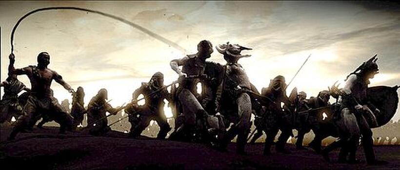 The second day of battle begins. Silhouetted forms, whips crack, barbarians howl. 