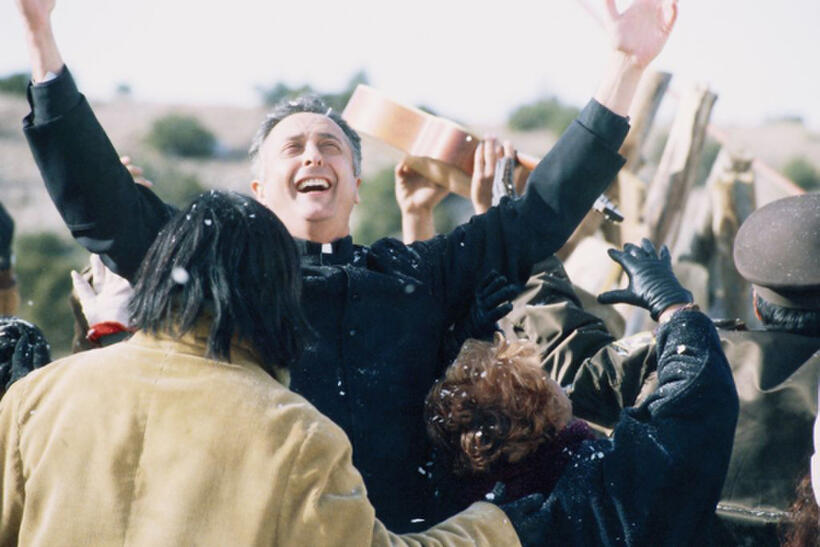Father Pancracio and the other towns people watch tortilla pieces fall from the sky in "Tortilla Heaven."