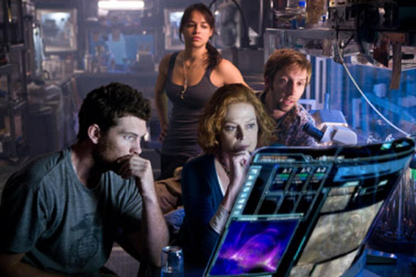 As an epic battle approaches, Jake (Sam Worthington, left), Grace (Sigourney Weaver), Trudy (Michelle Rodriguez) and Norm (Joel David Moore) plan their next move. 