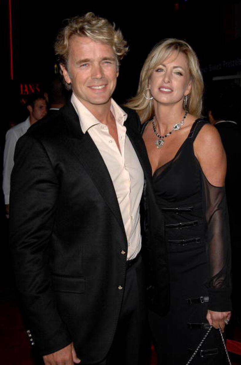 Actor John Schneider and guest at the Universal City premiere of "Elizabeth: The Golden Age."