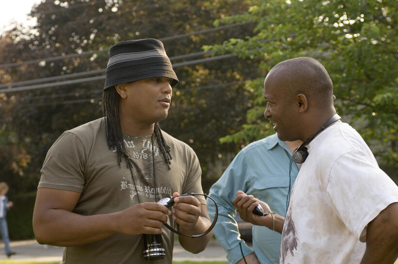 Director Franc Reyes and producer John Singleton on the set of "Illegal Tender." 