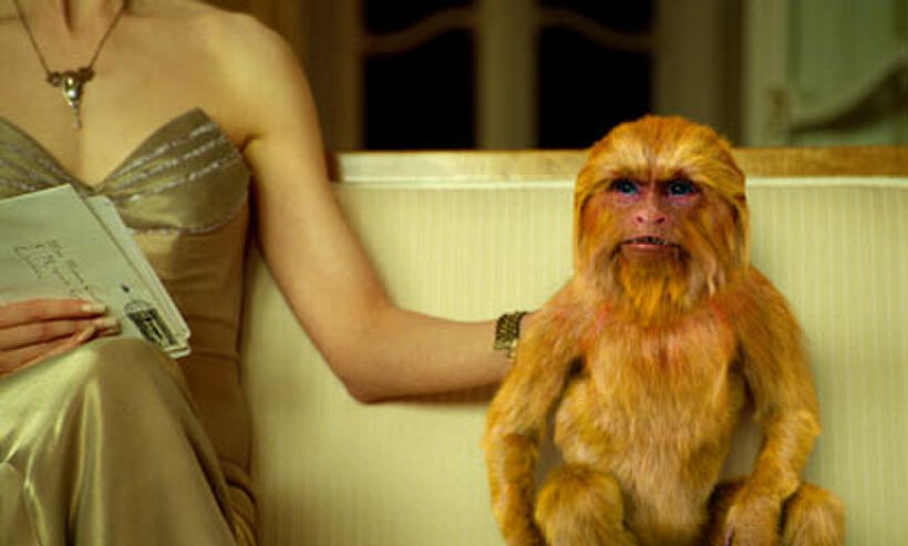 Nicole Kidman as Mrs. Coulter as she sits with her daemon the Golden Monkey in "The Golden Compass."