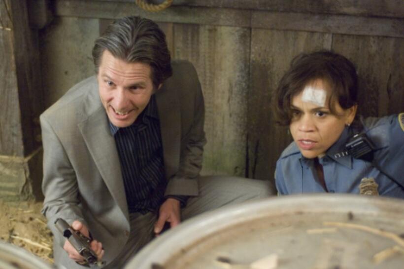 Gary Cole as Ted Jones and Rosie Perez as Carol in "Pineapple Express."