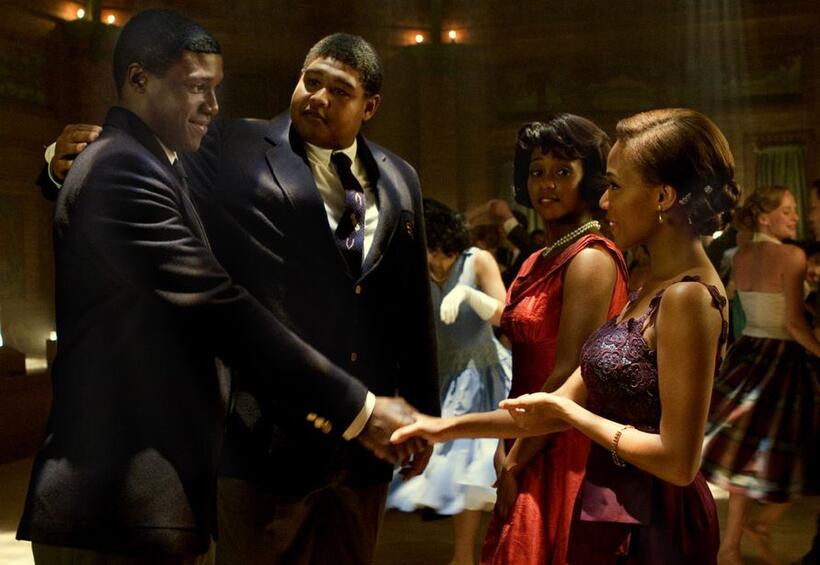 Ernie Davis (Rob Brown) and teammate Jack Buckley (Omar Benson Miller) charm Gloria Baker (Linara Washington) and Sarah Ward (Nicole Behaire) in "The Express."