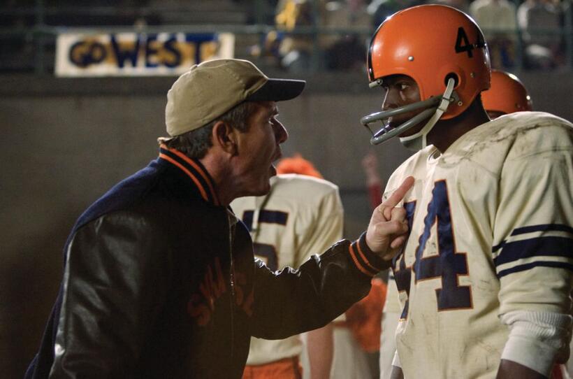 Dennis Quaid as Coach Ben Schwartzwalder and Rob Brown as Ernie Davis in "The Express."