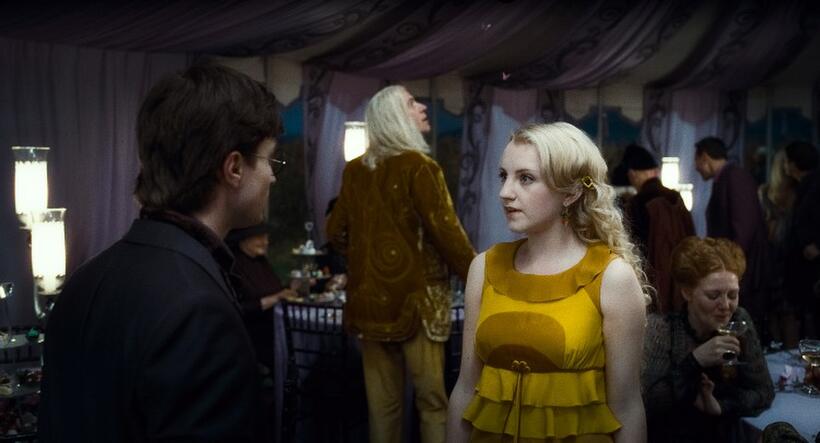 Daniel Radcliffe as Harry Potter, Rhys Ifans as Xenophilius Lovegood and Evanna Lynch as Luna Lovegood in "Harry Potter and the Deathly Hallows - Part 1."