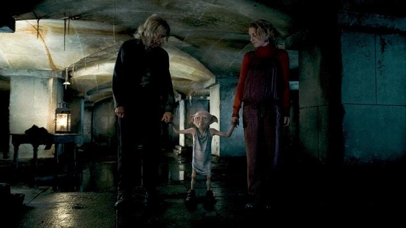 John Hurt as Ollivander, Dobby voiced by Toby Jones and Evanna Lynch as Luna Lovegood in "Harry Potter and the Deathly Hallows - Part 1."