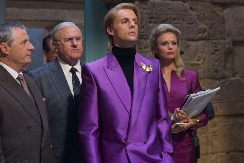 Walter Addison as Lee Iacocca, Matthew Goode as Adrian Veidt and Sonya Salomaa as his assistant in "Watchmen."