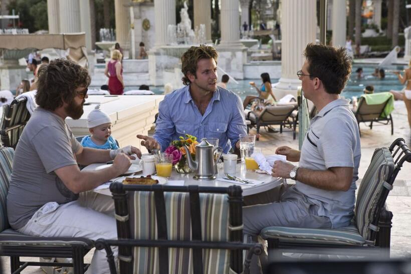 Zach Galifianakis as Alan, Baby Tyler, Bradley Cooper as Phil and Ed Helms as Stu in "The Hangover."